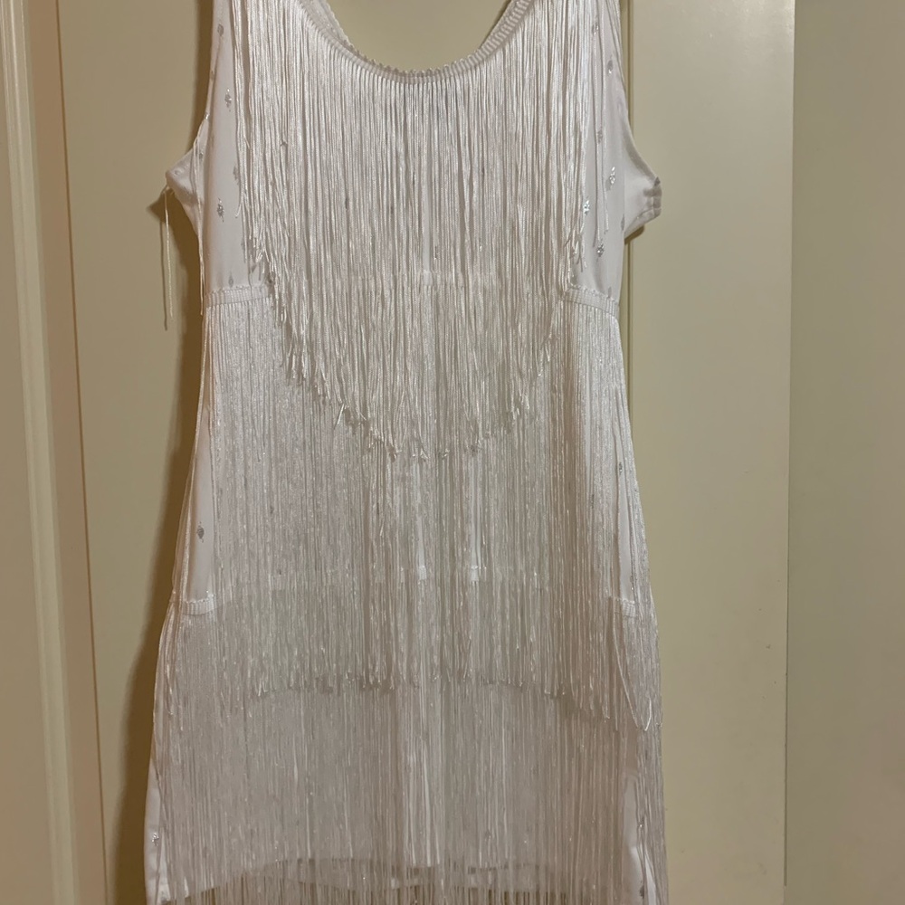 White fringe dress, new with tags. Zips on side. Size XL but runs small.
